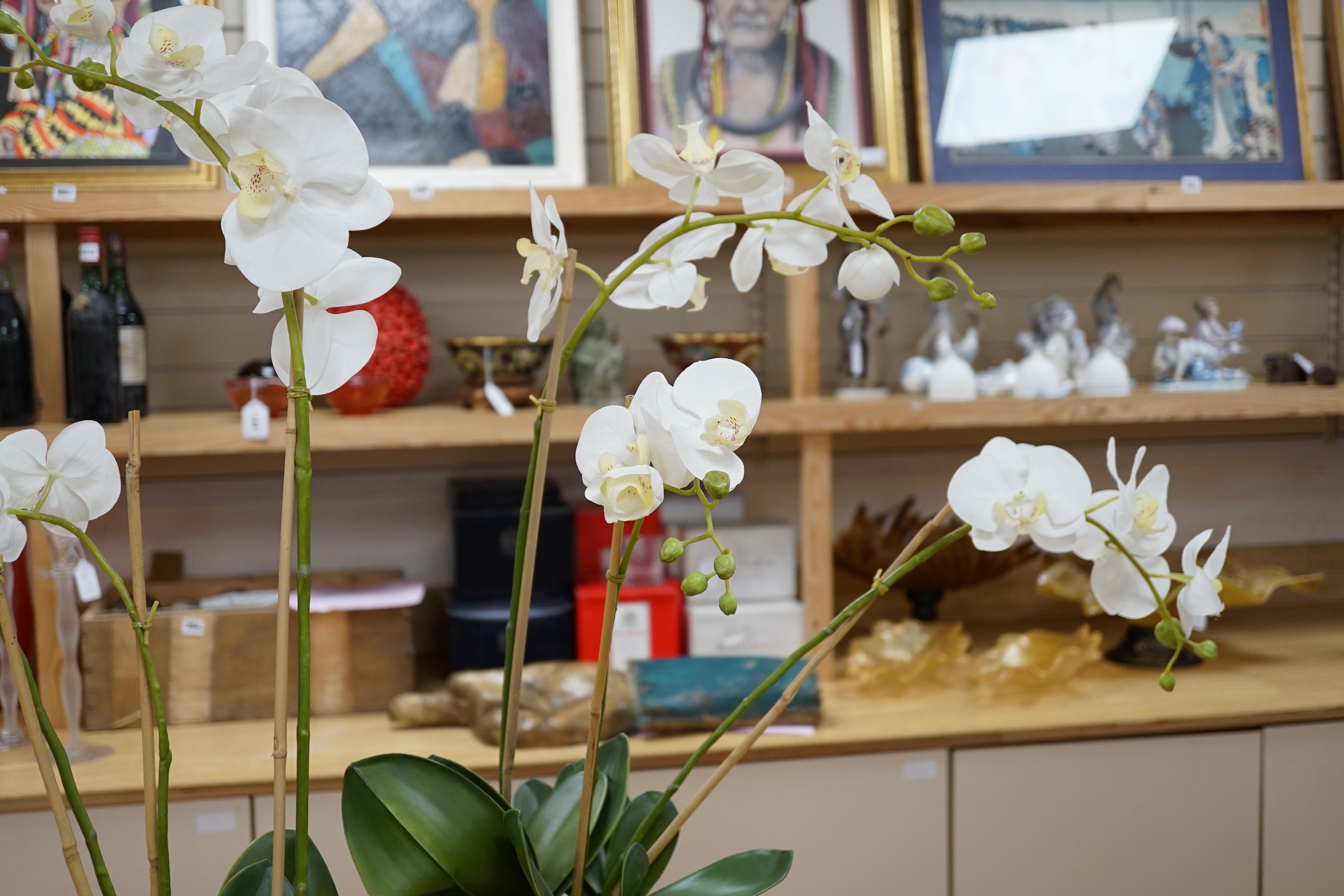 A pair of green glass Lalique style 'Haviland' signed vases with horse design and faux orchid plants within, 26cm high